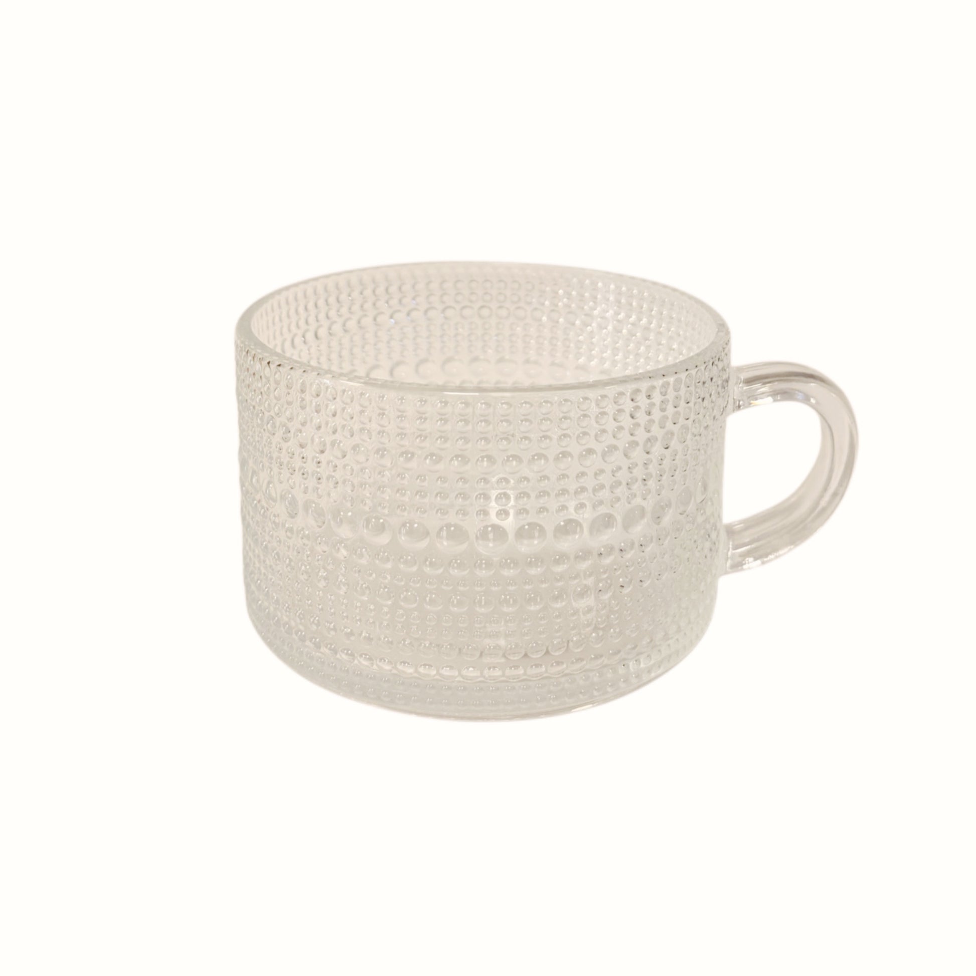 Tazza in vetro trasparente con decorazione geometrica a rilievo e manico